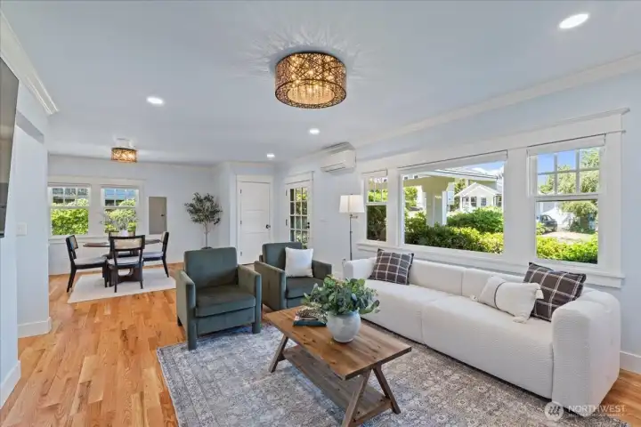 Filled with natural light and anchored by solid oak hardwood floors, this inviting space was designed for both quiet evenings and lively gatherings. Filled with natural light and anchored by solid oak hardwood floors, this inviting space was designed for both quiet evenings and lively gatherings.