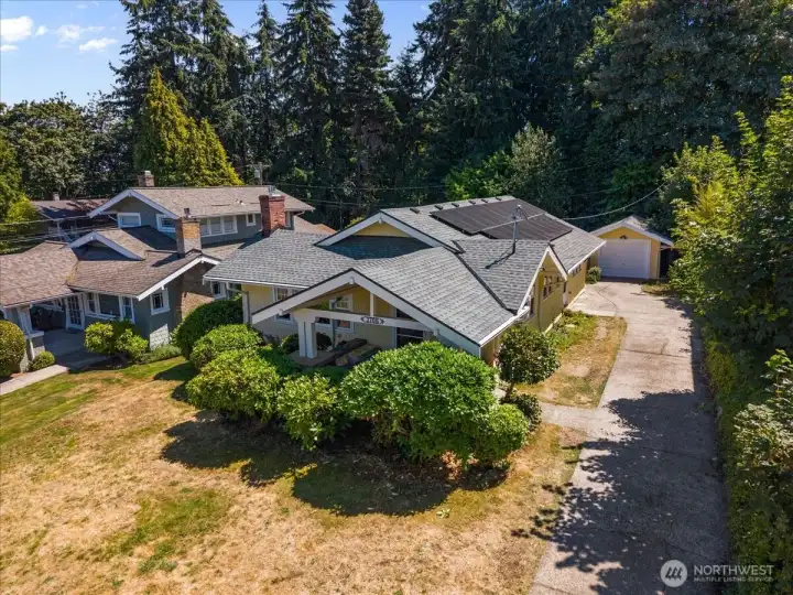 An expansive driveway provides generous off-street parking with room for an RV, boat, trailer, or recreational vehicles. An expansive driveway provides generous off-street parking with room for an RV, boat, trailer, or recreational vehicles.
