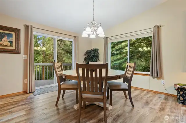 Dining area with large slider to private deck