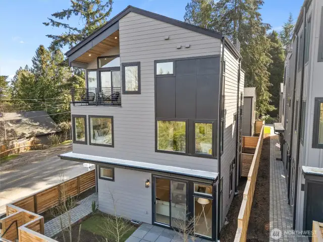 1261 NE 100th St in Maple Leaf. 5BR, 3.25BA with view Rooftop Deck plus private balcony off Primary Suite.