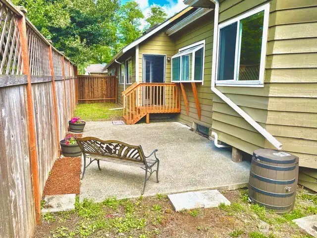 This is the private, fenced side yard for the large house.
