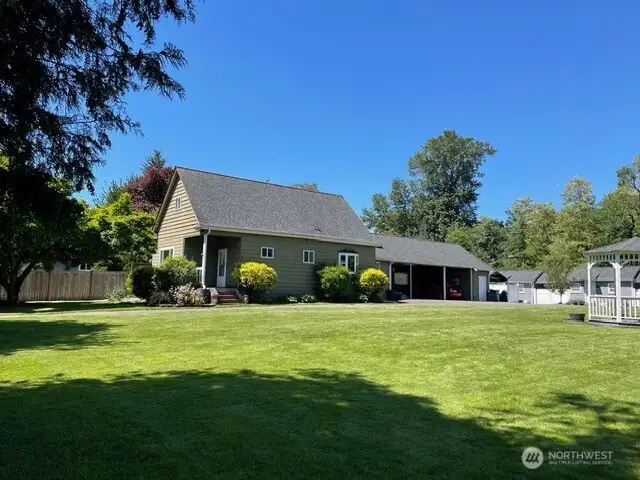 There is a large carport for the main house spacious enough for two cars. The far shed has the shared laundry for the tiny homes.