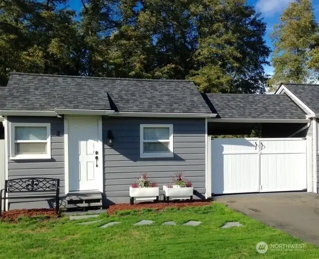 The four 225sf cottages enjoy a covered carport that doubles as a covered patio facing the river.