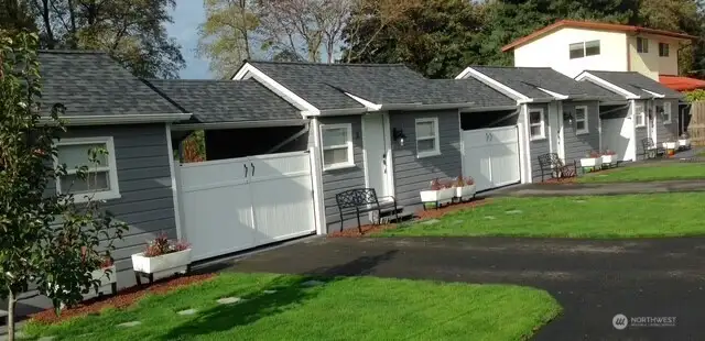 The tiny home remodels included new roofs and fresh paint outside.