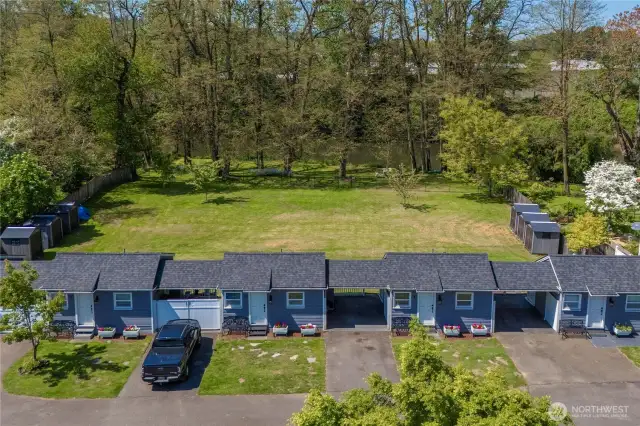 The fully remodeled tiny homes look out to a beautiful landscape and the park-like riverfront.