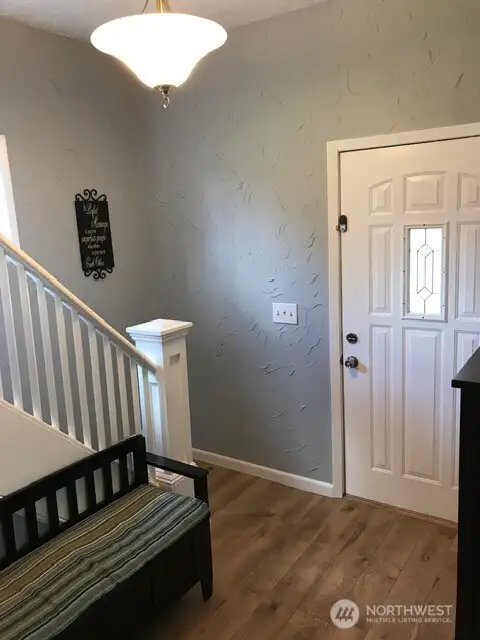 The large house has 2 bedrooms up & a primary bedroom and 1.75 baths with laundry on the main floor.