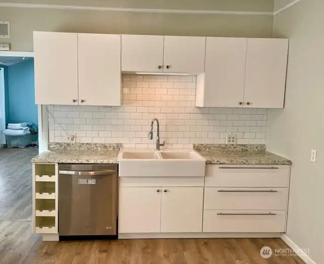 The kitchen remodel included new cabinetry and the charm of a farm house sink.