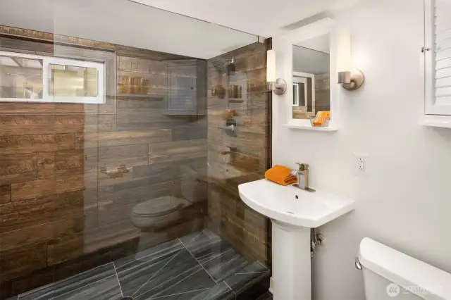 Gorgeous bathroom in the basement apartment has high end finishes.