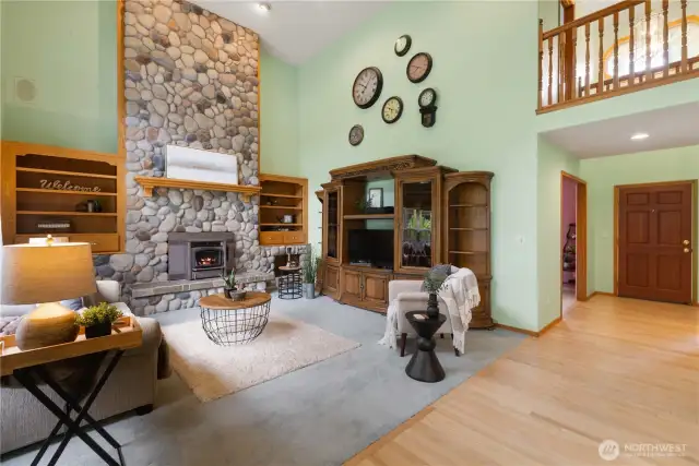 Great room w/ river rock floor-to-ceiling  fireplace