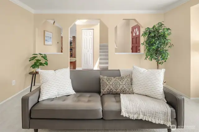 Family room w Stairs to the 4 bedrooms and hallway to the fireplace room