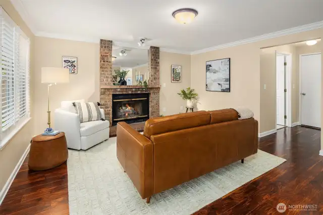 Fireplace Den w Half-Bath to the right, Door to Attached 3 car Garage and Built in Shop-Storage