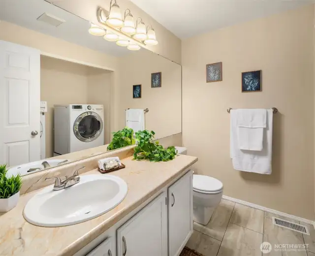 Half bath downstairs adjacent to the Garage and Fireplace Den