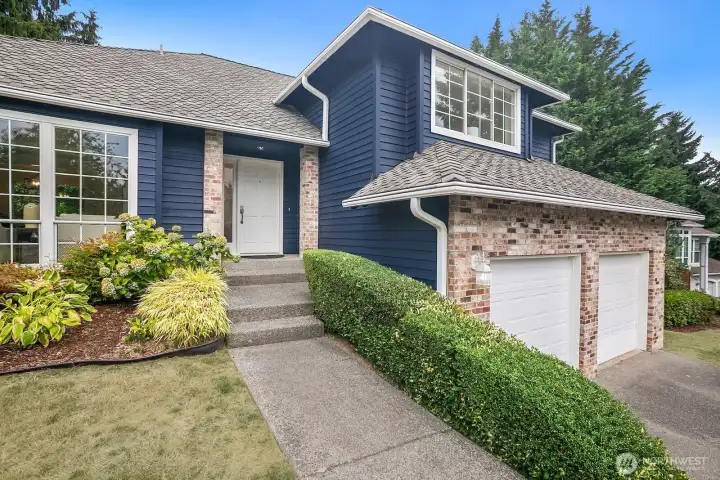 The home has a newer 30+ year architectural roof with leafguard gutters.  The garage is oversized and allows for a workbench and additional storage options.