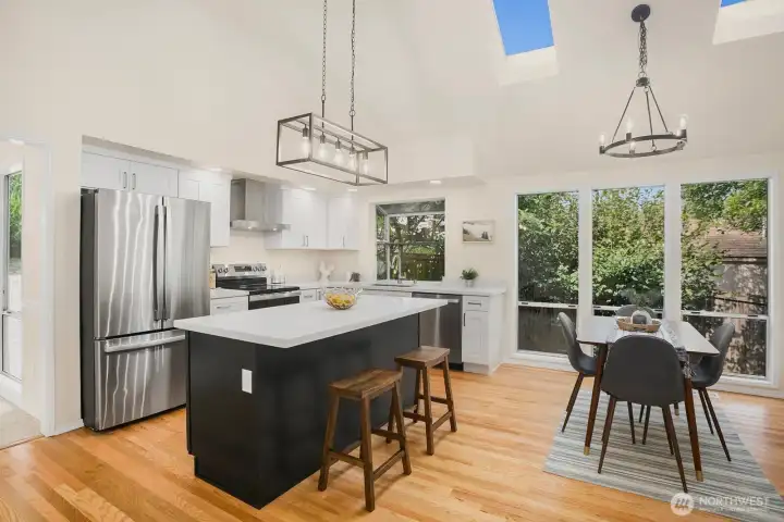 At the heart of the home is the glorious kitchen with soaring ceiling and skylights.  This is where you'll spend a lot of time, so isn't it nice to know you'll feel the openness and light in many of your daily activities.