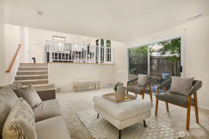 The cozy family room enjoys a gas fireplace and sliders out to the backyard and patio.
