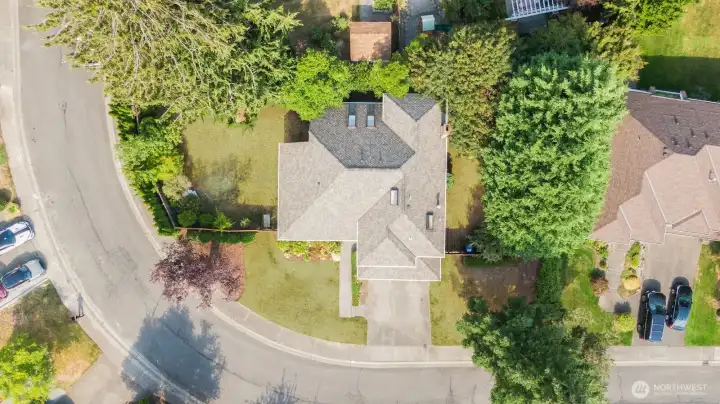 The back patio connects the west yard, sunny and perfect for veggie and flower garden, and the east yard, which is shadier and a great place for a play structure out of the direct sun.  The yards are ready for your green thumb and have lots of mature plants and a lovely apple tree!