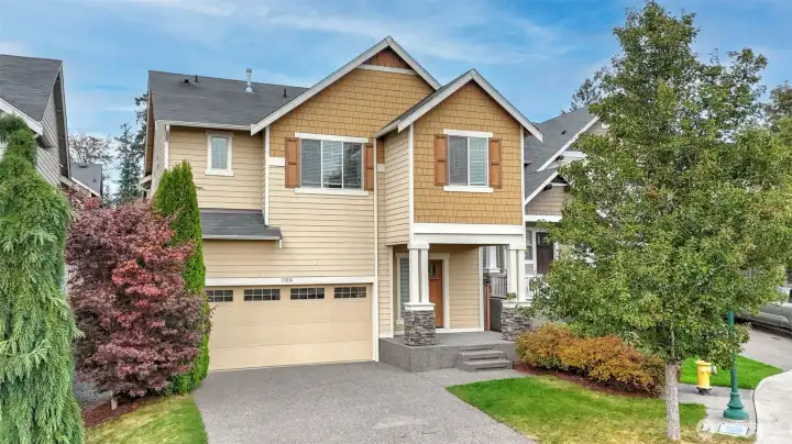 Front of house with 2 car garage and plenty of parking