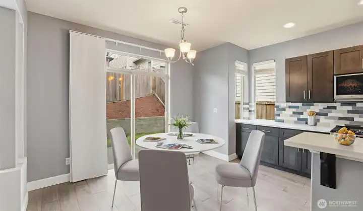 VIRTUALLY STAGED: eat in kitchen area for table and chairs