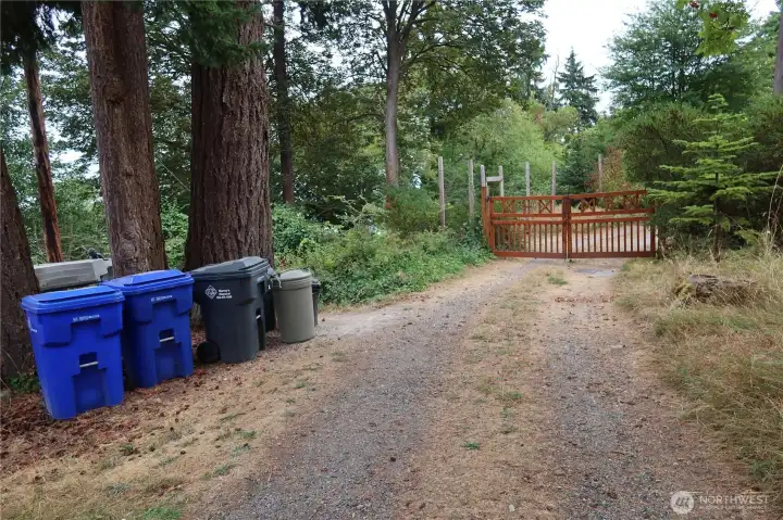 Entrance to steps/pathway to property. Turn left after garbage cans.