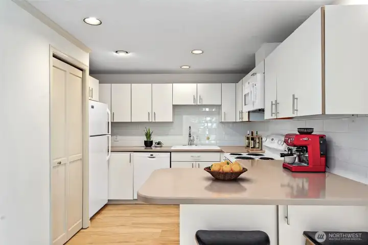 Kitchen has brand-new Subway Tile backsplash on each Wall.  New Faucet & Garbage Disposal.
