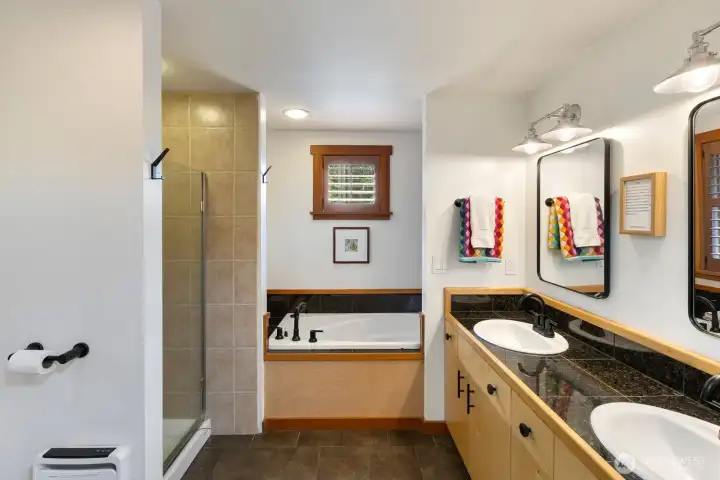 Primary Ensuite Bathroom with soaking tub and shower and dual vanity.