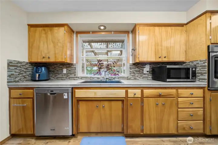 Garden window over looks beautiful backyard