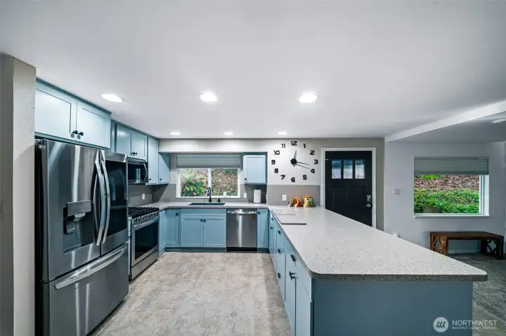 With solid surface counters, newer stainless appliances, plenty of counter and cabinet space, this kitchen has it all
