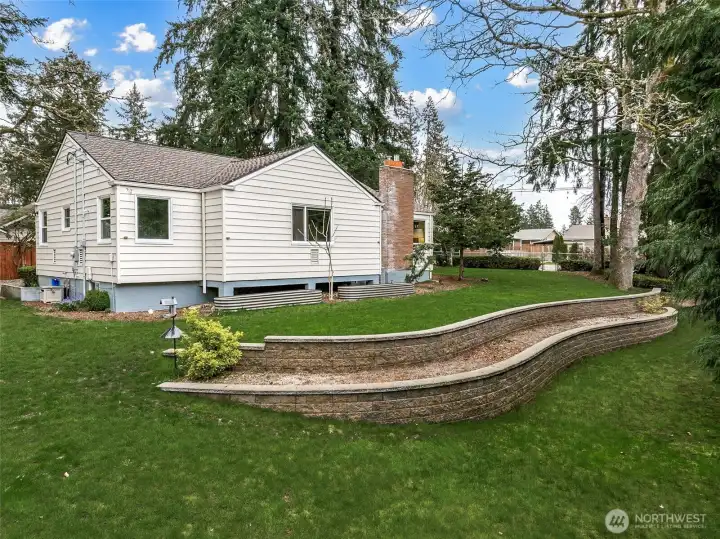 Private, park-like setting true to the charm found in this neighborhood, with mature heirloom trees and established rhododendron hedges.