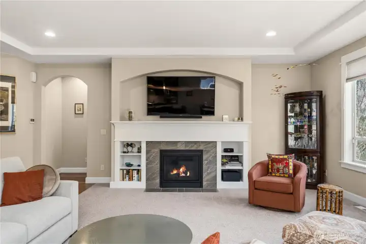 Facing fireplace with view of built-in bookcases