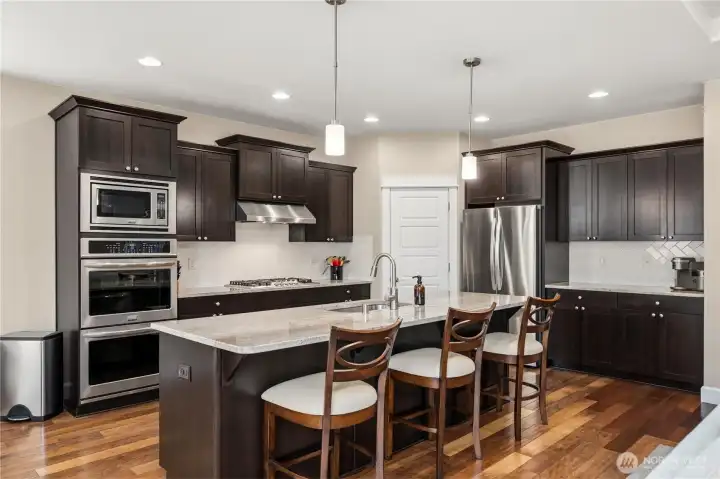 Hardwood floors, pendant lighting, lots or cabinet and counter top space