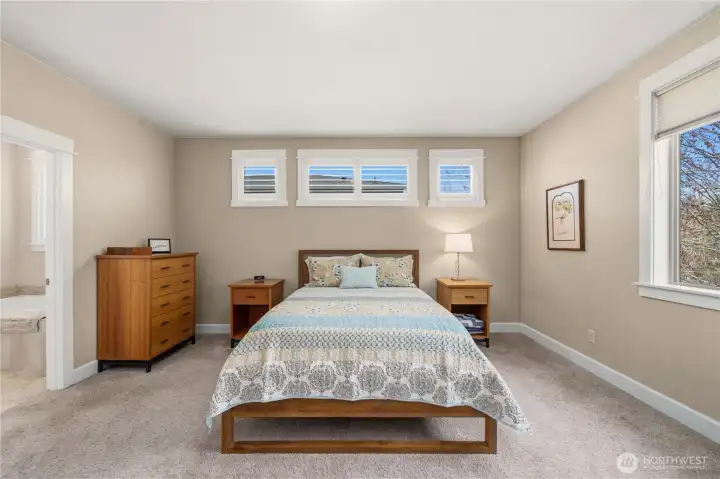 Close up of primary door to primary bathroom is to the left of the photos