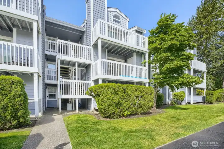 Entry into your new home with lush, manicured lawn and mature trees.