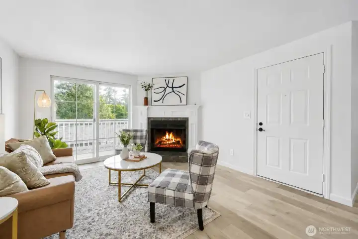 Cozy Living Room with oversized windows flood the space with natural lighting and secure balcony space.