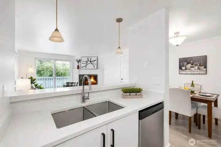 All new kitchen with quartz counters, under-mount sink and SS appliances