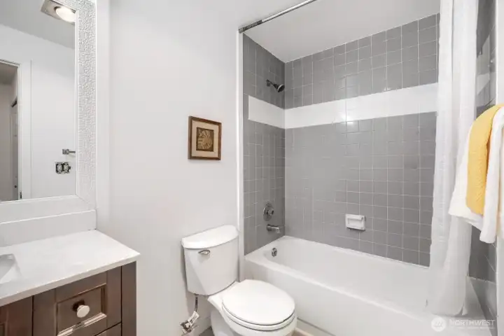 Open bathroom with soaking tube.