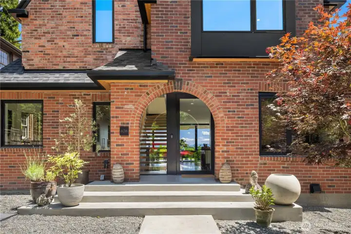 Nice covered level entry. Arch hints at modern remodel. Nice covered level entry. Arch hints at modern remodel.