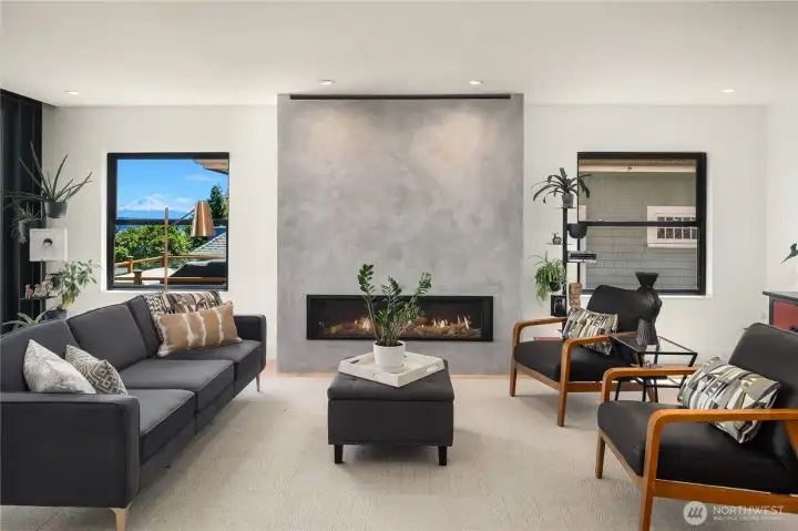 Striking Tadalakt plaster fireplace. Window frames Mt Rainier. Striking Tadalakt plaster fireplace. Window frames Mt Rainier.