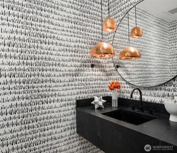 Half bath on main floor is roomy and stylish. Half bath on main floor is roomy and stylish.