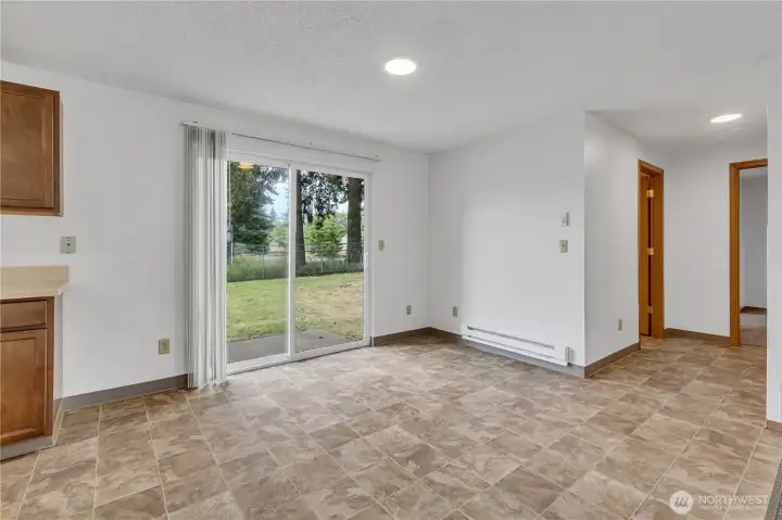 Large sliding glass doors for easy access to patio and large fenced yard - perfect for summer BBQ's! Large sliding glass doors for easy access to patio and large fenced yard - perfect for summer BBQ's!