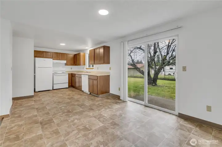 Open-concept kitchen with matching white-on-white dishwasher, range, range hood and refrigerator! Open-concept kitchen with matching white-on-white dishwasher, range, range hood and refrigerator!