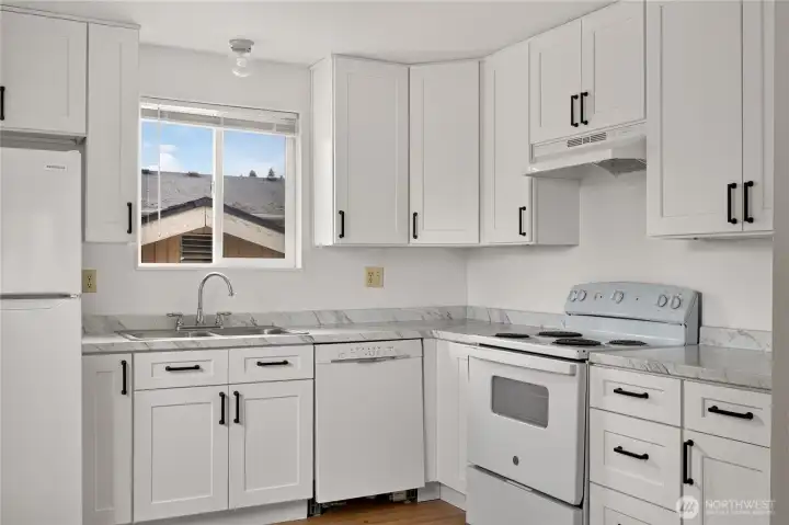 Unit B additional view of updated kitchen and appliances