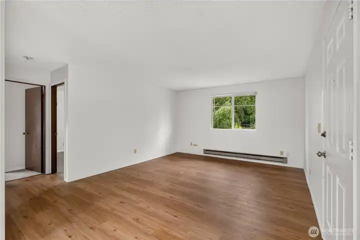 Unit B spacious living area with large windows