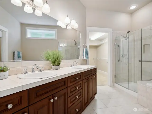 Primary bedroom double sink with counterspace and storage. Tastefully done and high ceilings throughout.