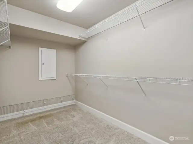 Primary walk in closet gives you plenty of space for your wardrobe.