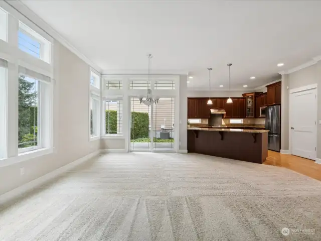 Wall of windows and high ceilings makes this light and bring living space the perfect place to call home.