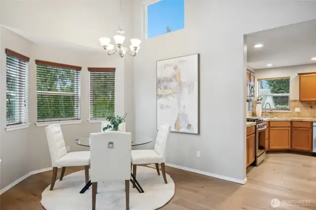 The formal dining room is accented with bay windows.