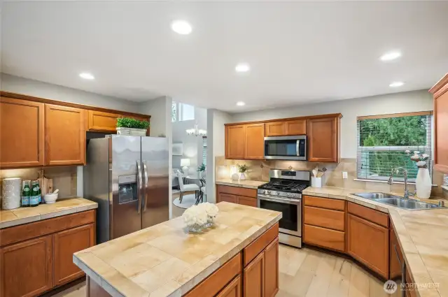 Stainless appliances and full-height backsplash add to the appeal of this kitchen.