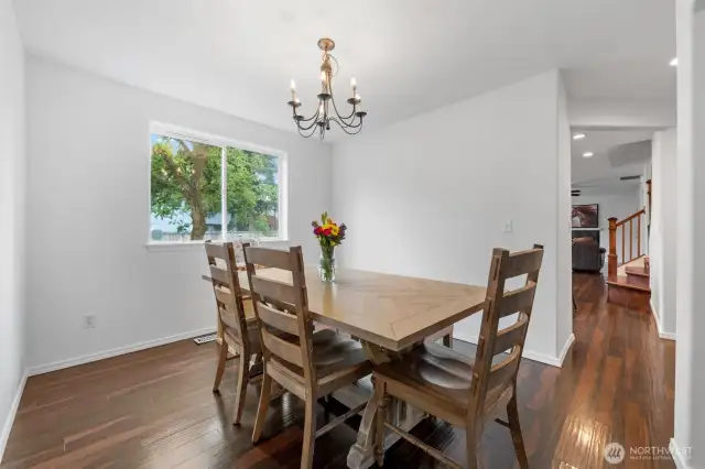 Dining Room, looking into Family room and stairs to the upstairs on the right