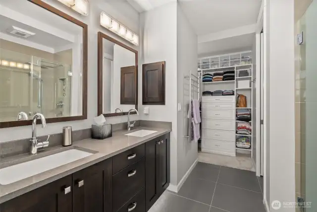 The primary bath has dual sinks, picture frame mirrors, a delicious towel warmer, OVERSIZED walk-in closet (that goes around the corner). You'll appreciate the under cabinet night light too.