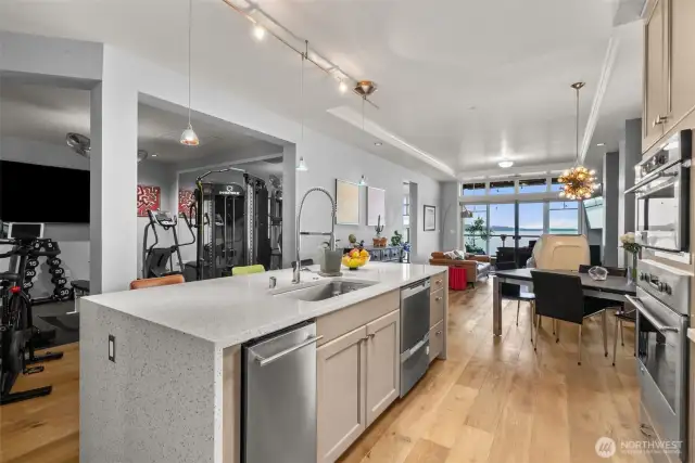 To the left, where the gym equipment is, is the dining room. Seller is negotiable on the workout stuff if a buyer is interested. Since there is a breakfast bar and eating nook, it turned out to be a good use of space.